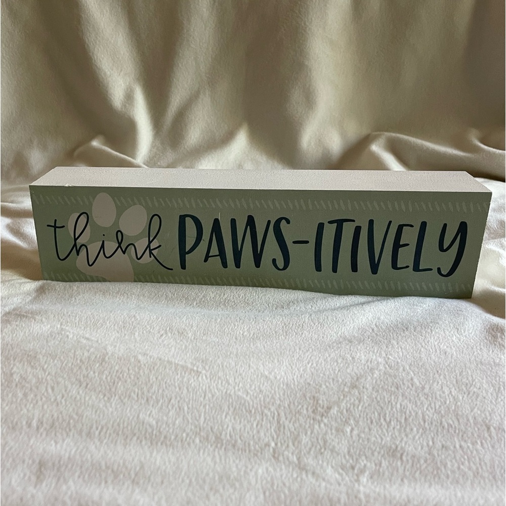 Home Decor wooden sign that says “Think Paws-itively”